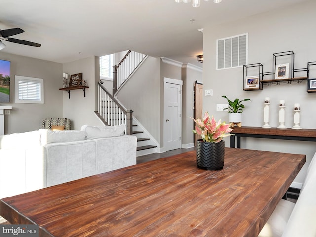 dining room featuring ceiling fan, crown molding, and hardwood / wood-style flooring