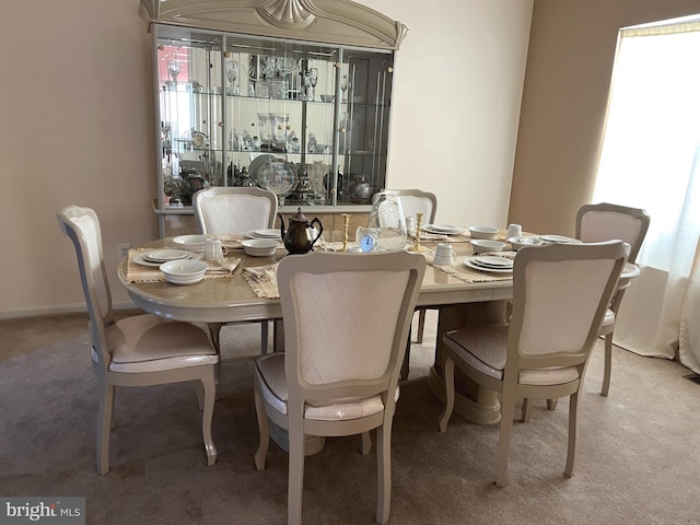 view of carpeted dining space