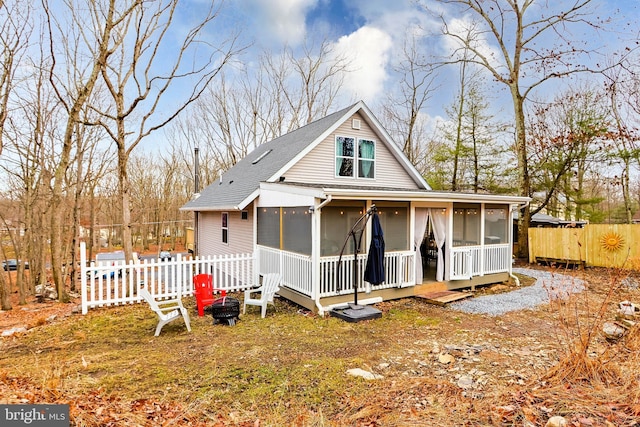 view of front of home with a sunroom