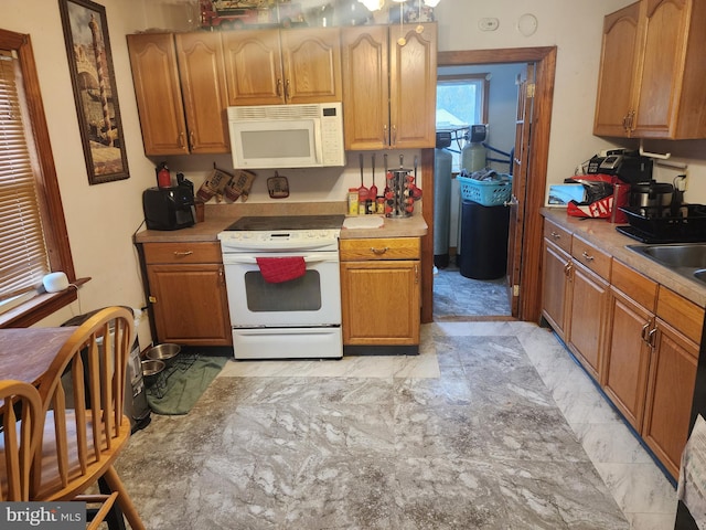 kitchen with white appliances and sink