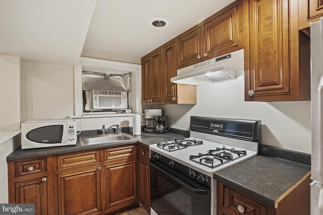 kitchen featuring sink, cooling unit, white appliances, and tile patterned flooring