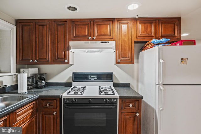 kitchen with white appliances and sink