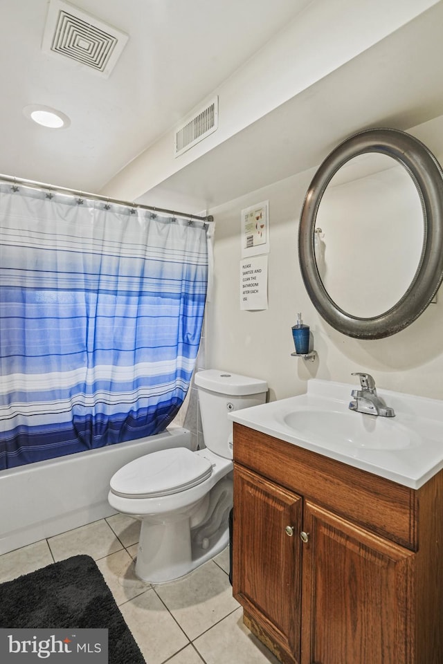 full bathroom with tile patterned floors, vanity, toilet, and shower / bath combo