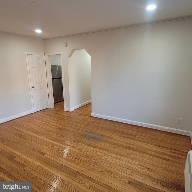 unfurnished room with light hardwood / wood-style floors