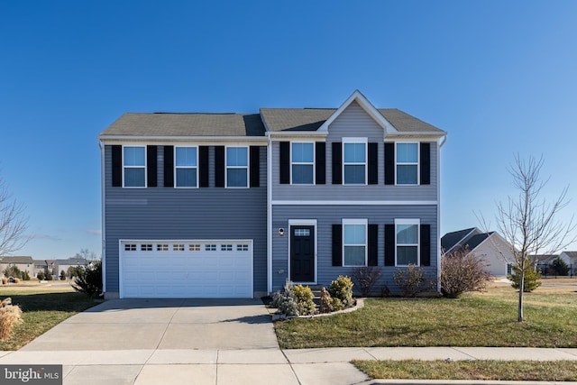 view of front facade featuring a garage and a front lawn