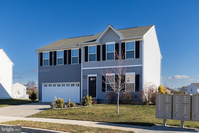 view of front of house with a front yard and a garage