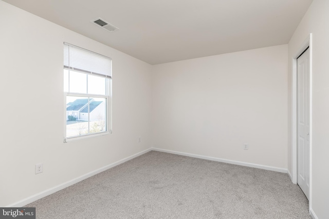 unfurnished bedroom featuring light colored carpet