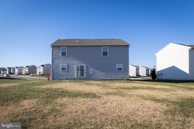 back of house with a yard