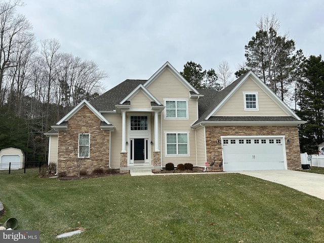 view of front facade featuring a garage and a front yard