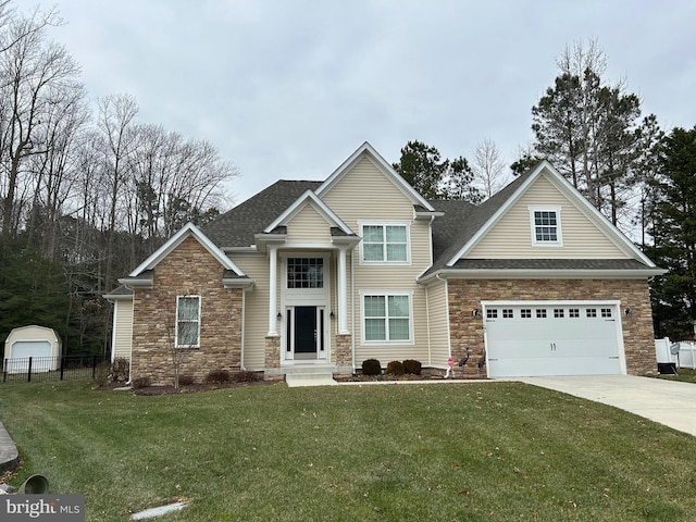 view of front of house featuring a front yard and a garage