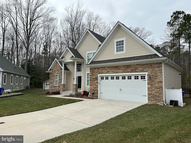 view of front facade featuring a front yard and a garage