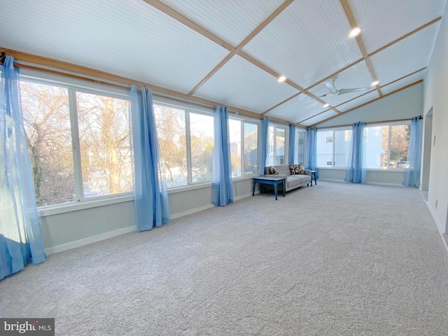 unfurnished sunroom featuring lofted ceiling and a wealth of natural light