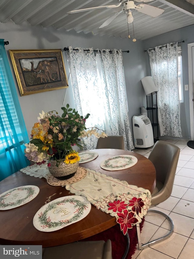 dining area with beam ceiling, ceiling fan, and light tile patterned floors