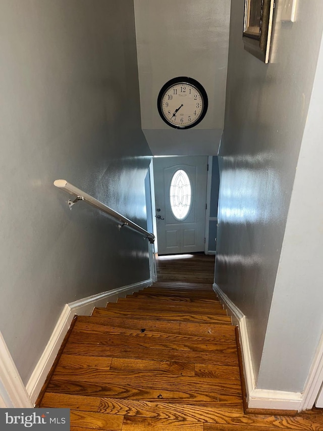 stairway with wood-type flooring