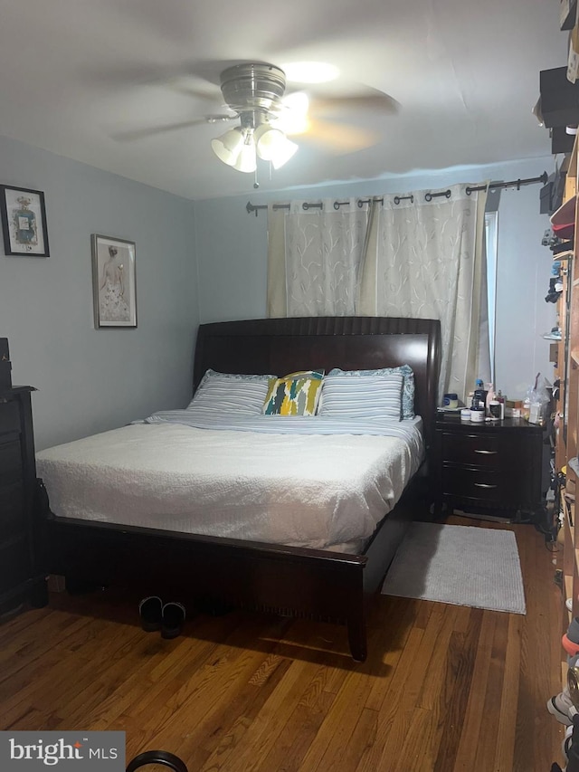 bedroom featuring ceiling fan and hardwood / wood-style floors