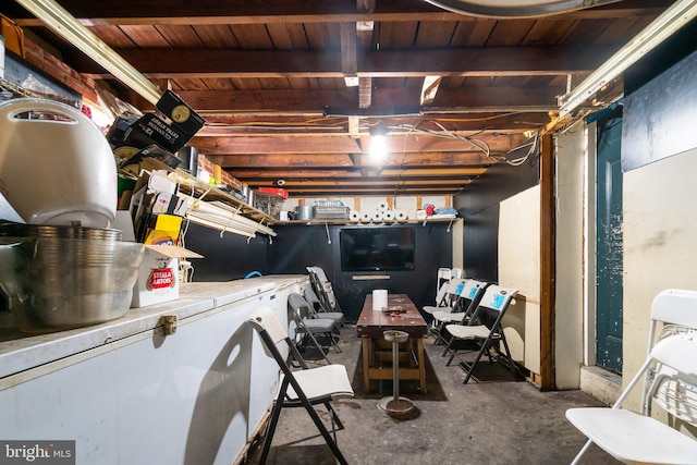 basement featuring wooden ceiling