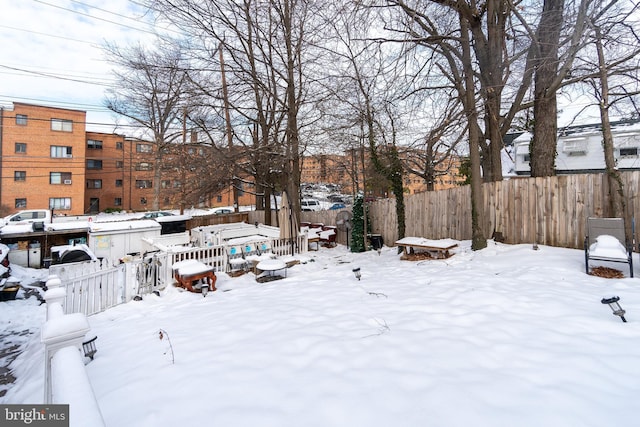 view of yard covered in snow