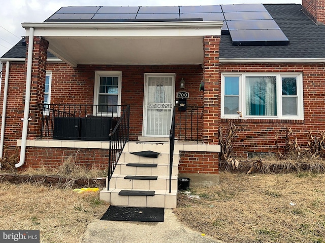 property entrance with solar panels