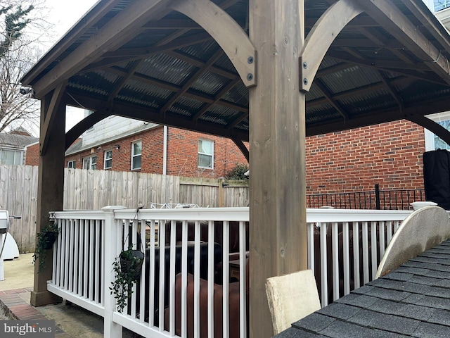 view of side of property with a gazebo and a deck