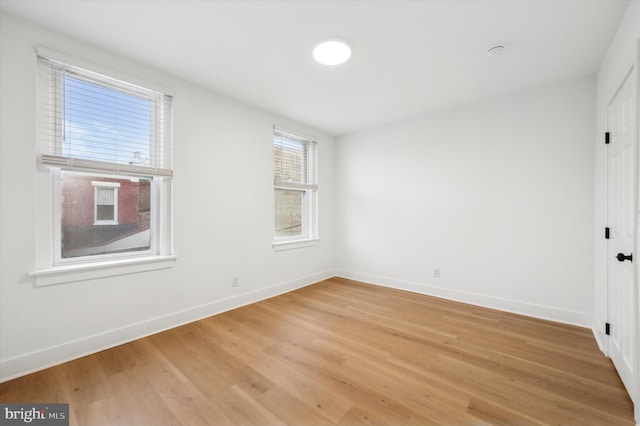 spare room featuring hardwood / wood-style flooring