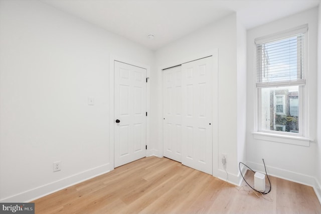 interior space featuring light wood-type flooring and a wealth of natural light