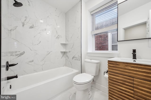 full bathroom with vanity, toilet, and tiled shower / bath