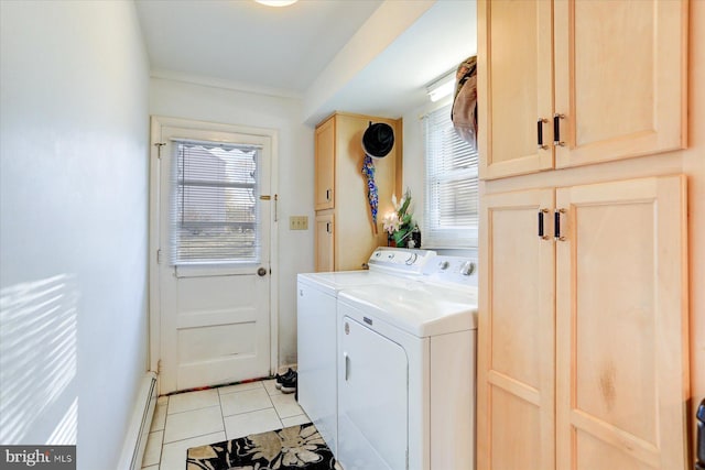 laundry area featuring cabinets, crown molding, washer and dryer, baseboard heating, and light tile patterned flooring