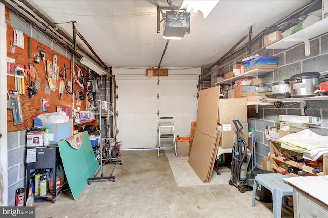 garage featuring a workshop area and a garage door opener