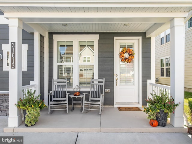 doorway to property with covered porch