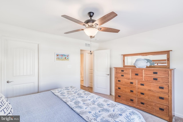 carpeted bedroom with ceiling fan