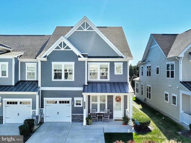 view of front facade featuring a porch and a garage