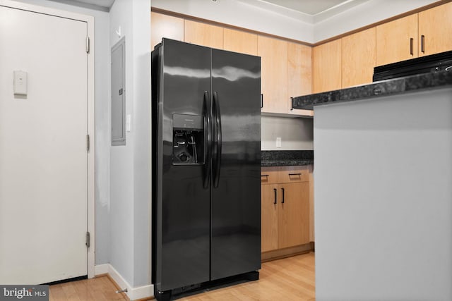 kitchen with light brown cabinetry, light hardwood / wood-style flooring, and fridge with ice dispenser