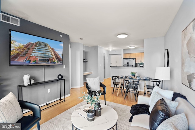 living room with light hardwood / wood-style floors