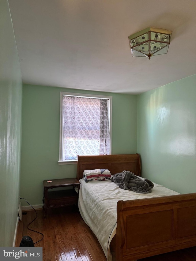 bedroom featuring dark wood-type flooring