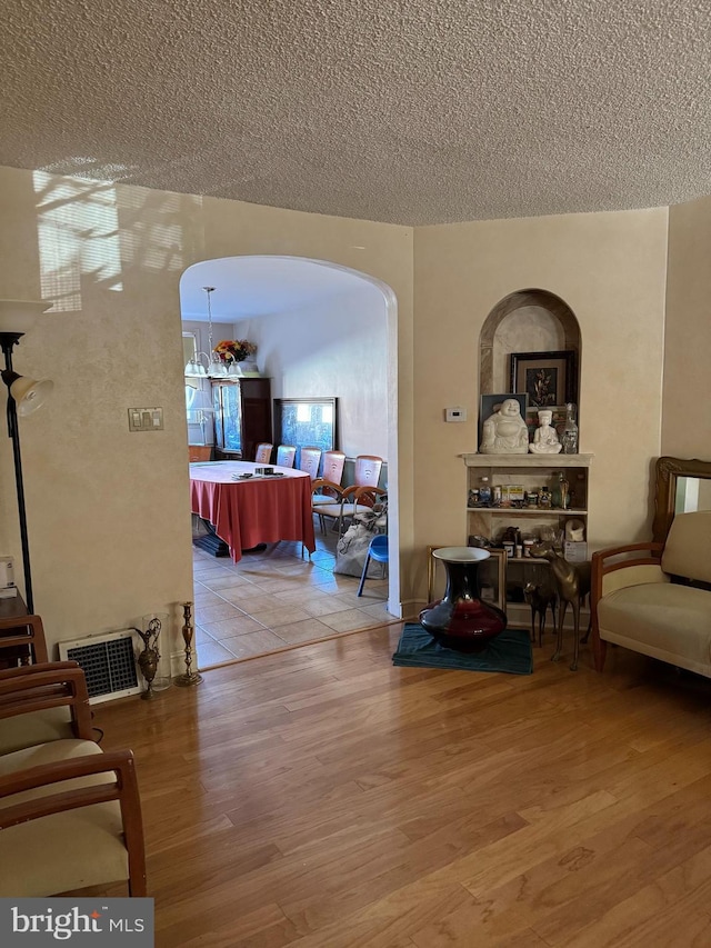 interior space featuring hardwood / wood-style floors and a textured ceiling