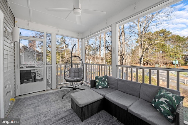 sunroom / solarium featuring ceiling fan and a healthy amount of sunlight