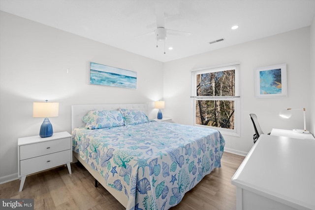 bedroom featuring hardwood / wood-style floors and ceiling fan