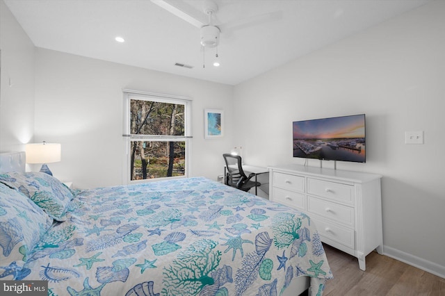 bedroom with light wood-type flooring and ceiling fan