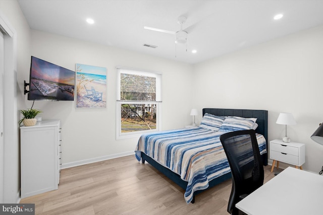 bedroom with ceiling fan and light wood-type flooring