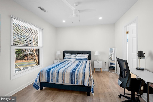 bedroom with ceiling fan and light wood-type flooring