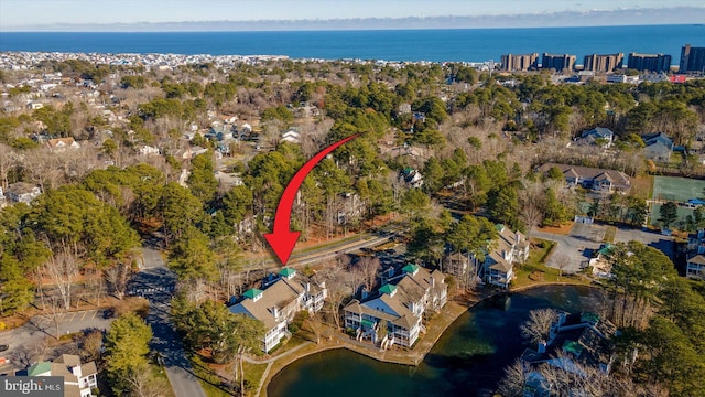 birds eye view of property with a water view