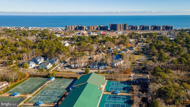 birds eye view of property with a water view