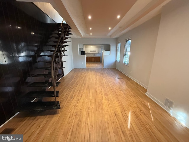 unfurnished living room featuring light hardwood / wood-style flooring