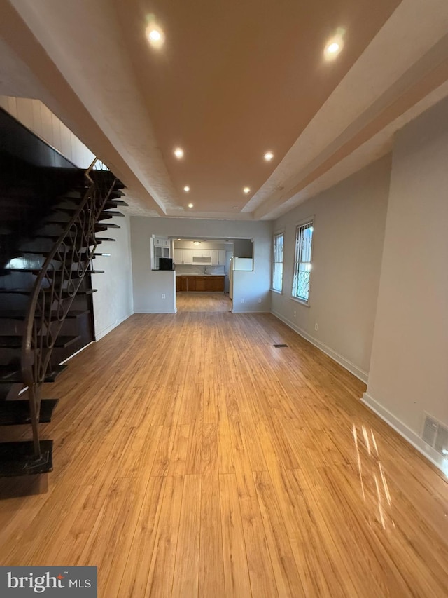 unfurnished living room featuring light hardwood / wood-style floors