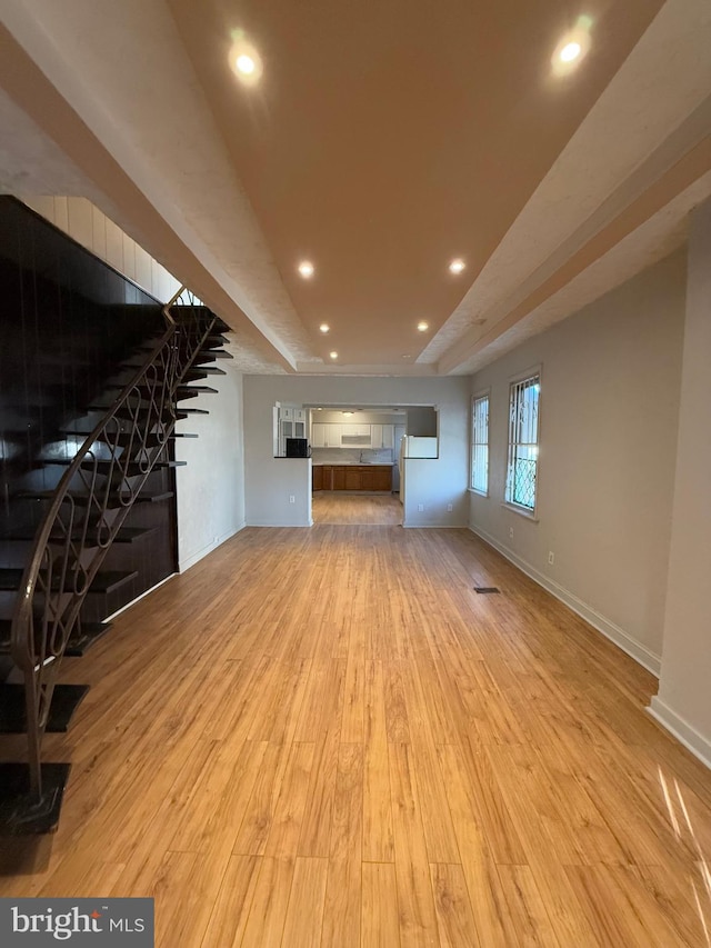 unfurnished living room featuring light hardwood / wood-style floors