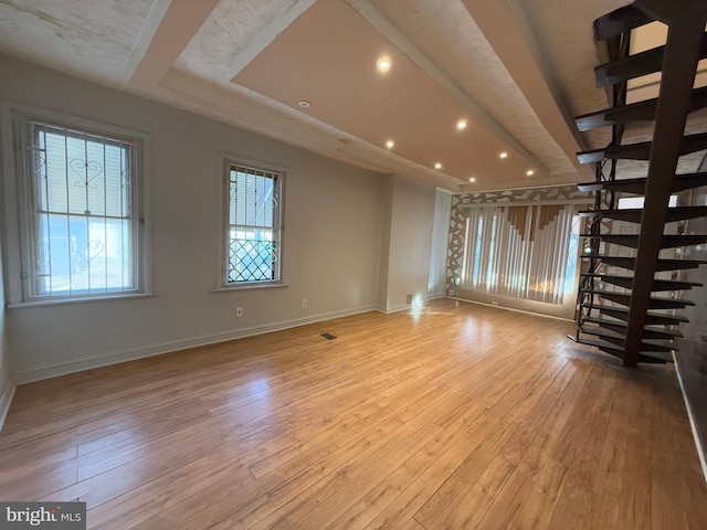 unfurnished living room with light hardwood / wood-style flooring