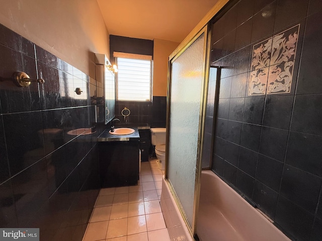 full bathroom featuring toilet, tile patterned flooring, vanity, and combined bath / shower with glass door