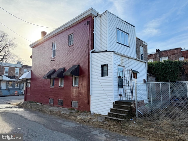 view of property exterior at dusk