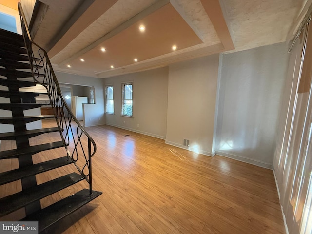 unfurnished living room with light wood-type flooring