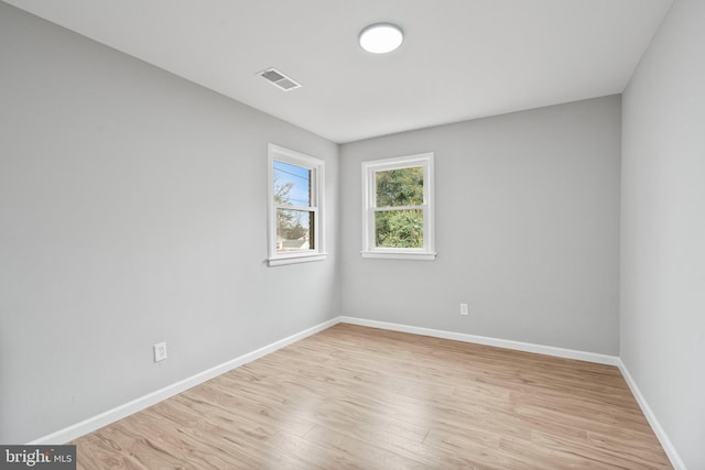 unfurnished room featuring light wood-type flooring